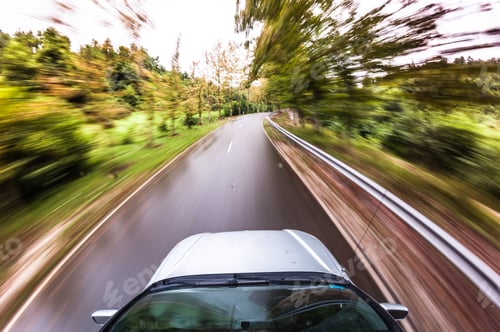 Preview: motion blurred picture of driving car