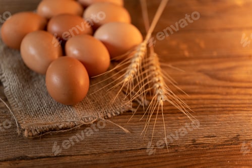 Preview: Brown eggs on a burlap on an old wooden table