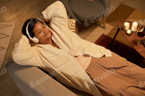 Preview: Senior Black woman listening to music
