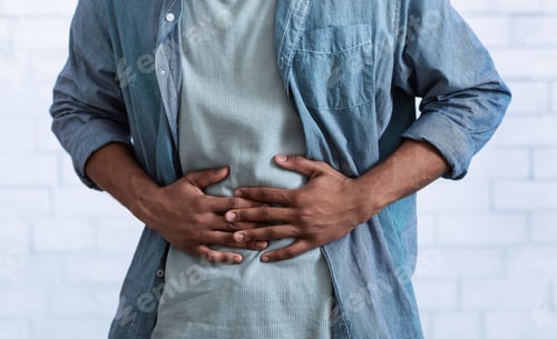 Preview: Black Guy Touching Aching Abdomen Having Stomachache, Gray Background, Cropped
