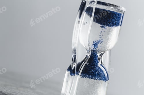 Preview: Close up hourglass on table