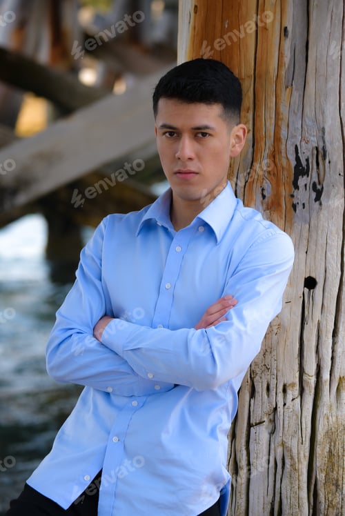Preview: A male model poses against a wooden pier