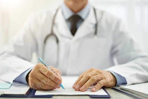 Preview: Doctor hands filling in patient medical chart
