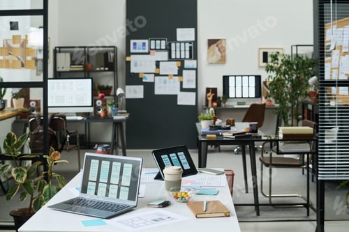 Preview: Modern Office Workspace Featuring Digital Devices and Project Planning Materials