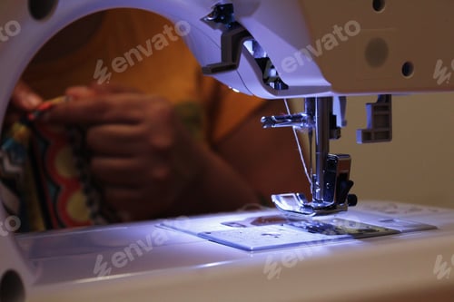 Preview: Woman using sewing machine
