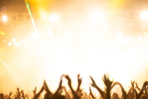 Preview: Crowd at concert and colorful stage lights.
