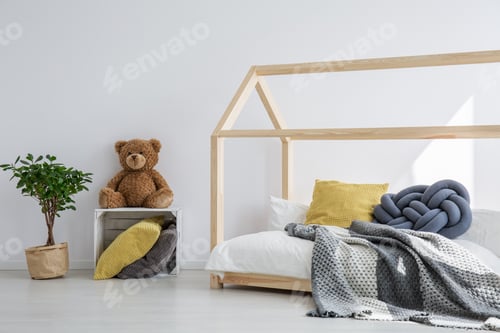 Cozy Bed with Cushions and Plant in Room