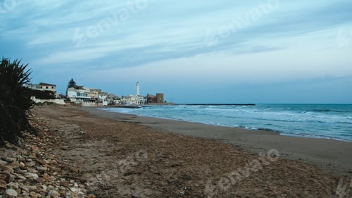 Preview: Lighthouse tower over the coast in Italy