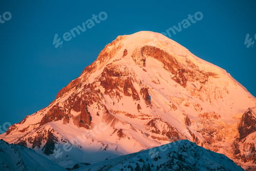 Preview: Georgia. Mount Kazbek Covered Snow In Winter Sunrise. Morning Da
