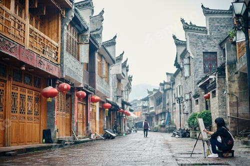Preview: Artist capturing the essence of an ancient street on a quiet morning.