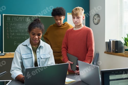 Preview: Multiethnic Teenagers Collaborating on Laptop during Classroom Technology Lesson