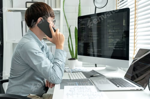 Preview: Male programmer is programming to develop program app and website of corporate while working