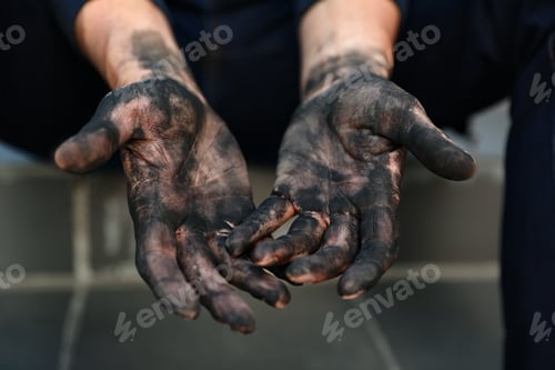 Preview: Dirty worker sitting on stairs, closeup of hands