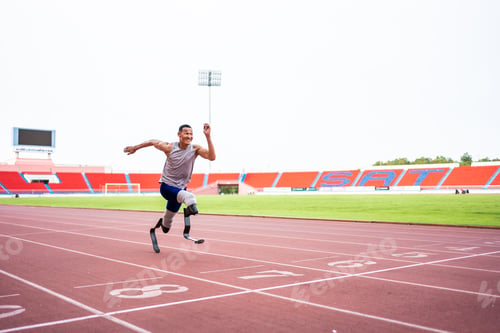 Preview: Asian para-athletes disabled with prosthetic blades running at stadium.