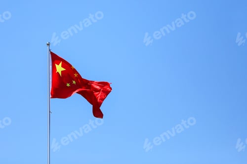 Preview: Chinese flag waving against clear blue sky