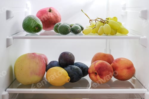 Preview: open fridge with fresh fruits and vegetables. refrigerator with healthy food.Healthy food concept