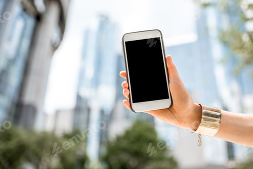 Preview: Holding a phone on the parliament building background