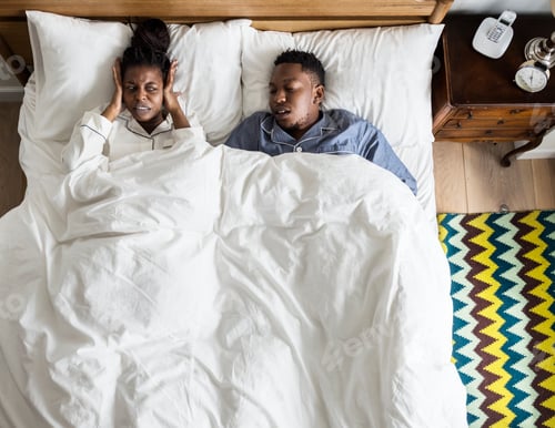 Preview: African American couple on bed, man snoring and disrupting woman