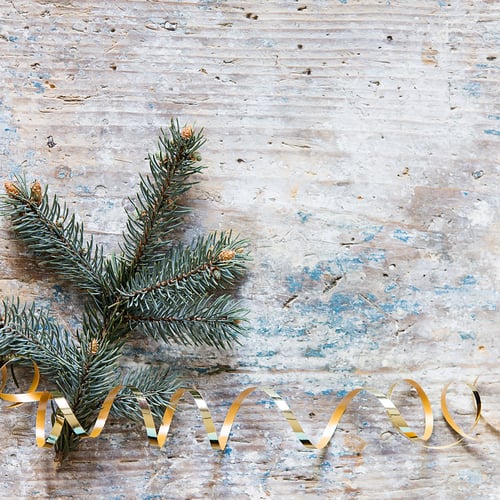 Preview: Christmas still festive life. Blank invitation mockup on old wooden background. Fir branches