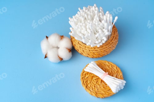 Preview: Set of cotton buds sticks on blue paper