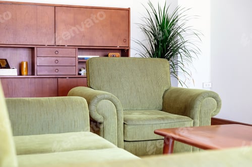 Preview: Interior of a modern living room with a green sofa and a coffee table