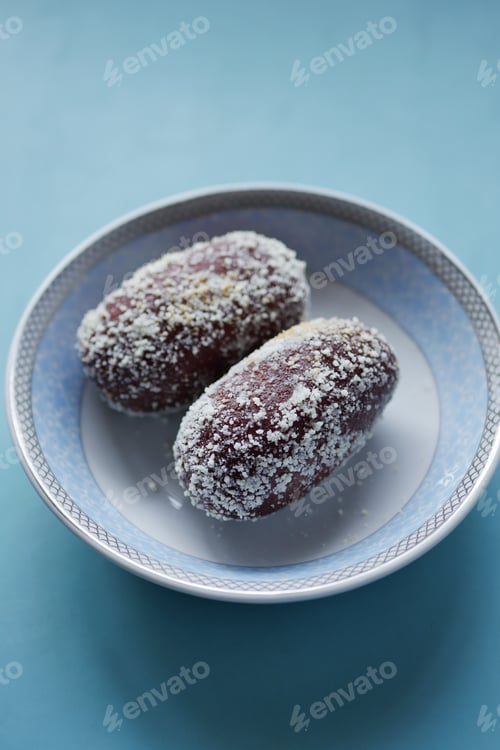 Preview: close up of indian sweet in a bowl on table.