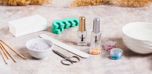 Preview: Set of items for manicure and pedicure on the table web banner