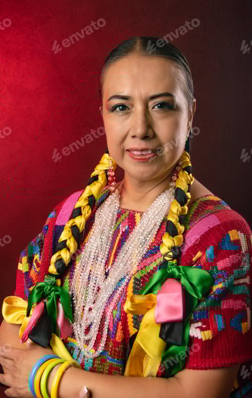Preview: A woman wearing a colorful outfit with a yellow and black braid on her head