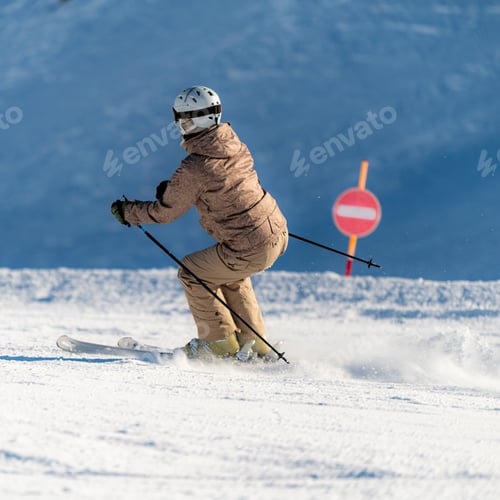Preview: Female skier skiing down the slope