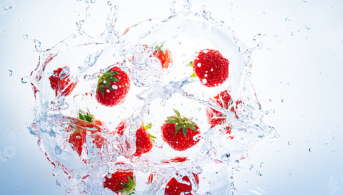 Preview: Raspberries splashing into clear water, view from top