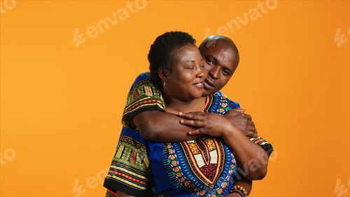 Preview: Loving husband embracing his wife in front of camera