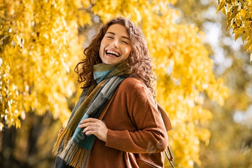 Preview: Happy girl laughing in autumn park