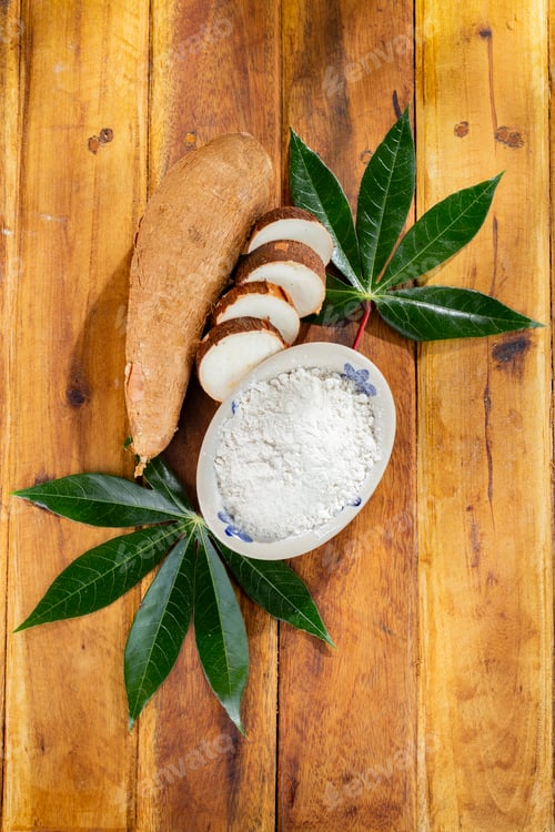 Preview: pile of cassava, cassava and cassava flour on a background of rustic wood (Manihot esculenta)