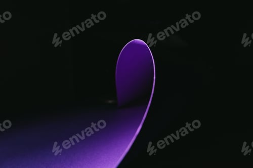 Preview: warping purple paper in shape of wave on black
