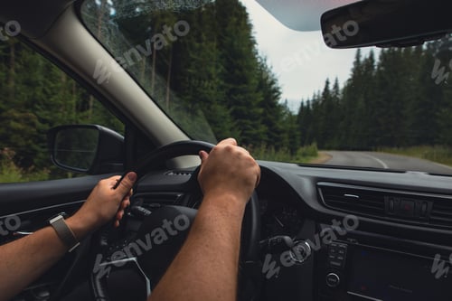 Preview: man hands on steering wheel