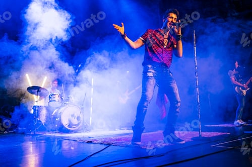 Preview: Rock and roll group performing live.