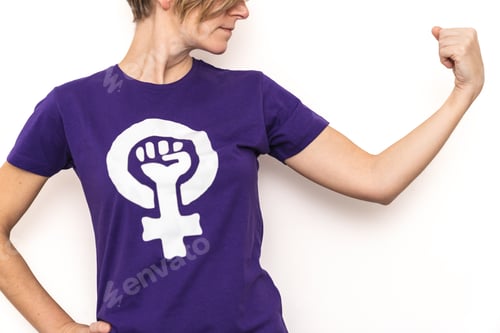 Preview: Woman showing strength and feminist symbol on t shirt for women's day