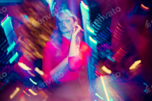 Preview: Cinematic portrait of handsome young woman in neon lighted room, stylish musician