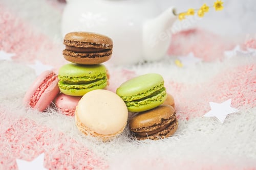 Preview: Delicious macarons with a tea in a teapot