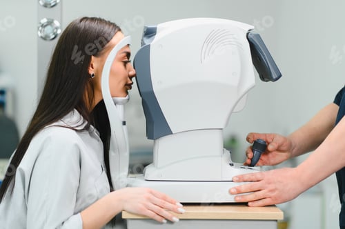 Preview: Woman undergoing professional eye examination at ophthalmology clinic