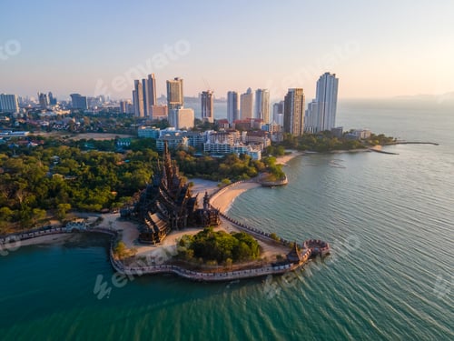 Preview: Sanctuary of Truth, Pattaya, Thailand, wooden temple by the ocean at sunset on the beach of Pattaya