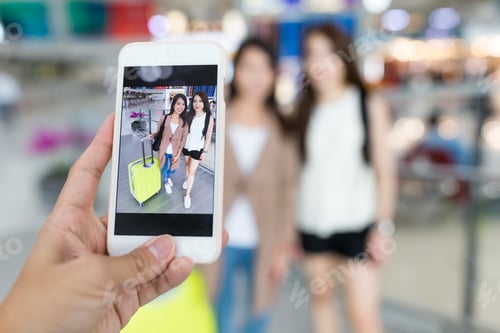 Preview: Taking photo on mobile phone in Hong Kong international airport