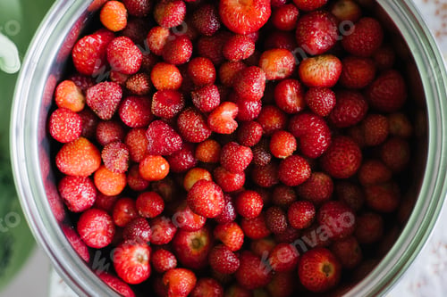 Preview: Berry background of strawberries close-up in a plate
