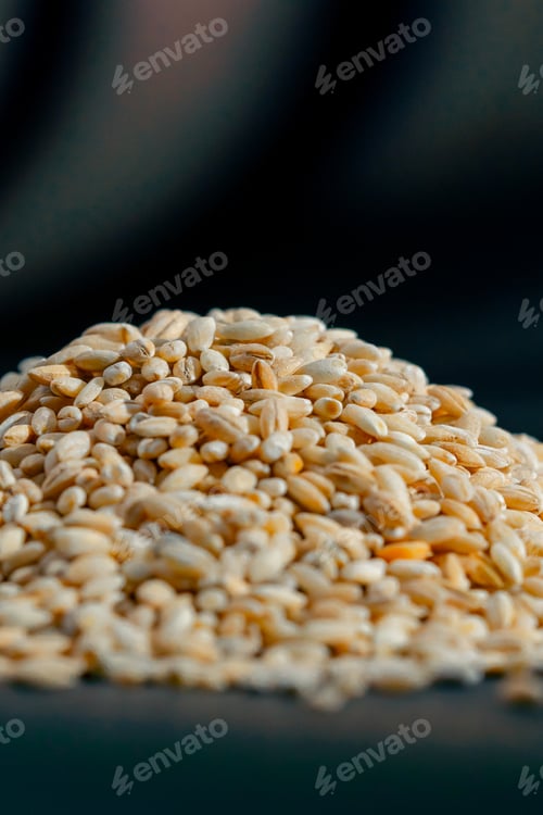 Preview: close up yellow wheat close-up lies on black and blue background Ukrainian culture, light protein