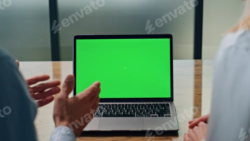 Preview: Laptop with Green Screen on Wooden Table