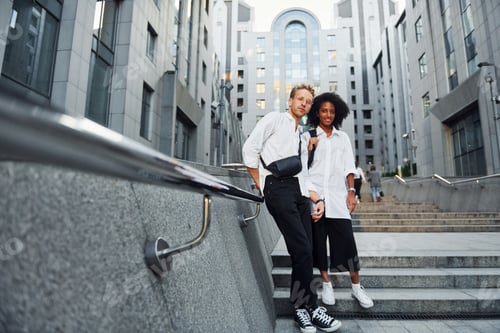 Preview: Man with afrian american woman together in the city outdoors