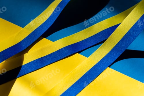 Preview: Close up view of blue and yellow ribbon on ukrainian flag