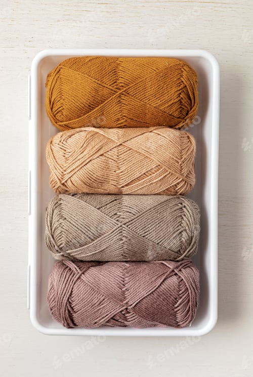 Preview: Craft hobby background with yarn in natural colors