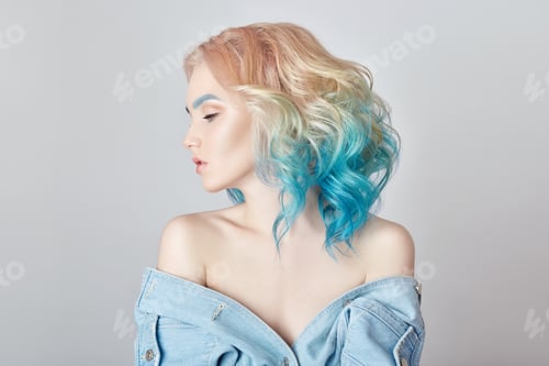 Preview: Portrait woman with bright colored flying hair, all shades purple blue. Hair coloring