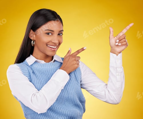 Preview: Woman, portrait and gun fingers in a studio pointing with emoji hand gesture with a smile. Happines